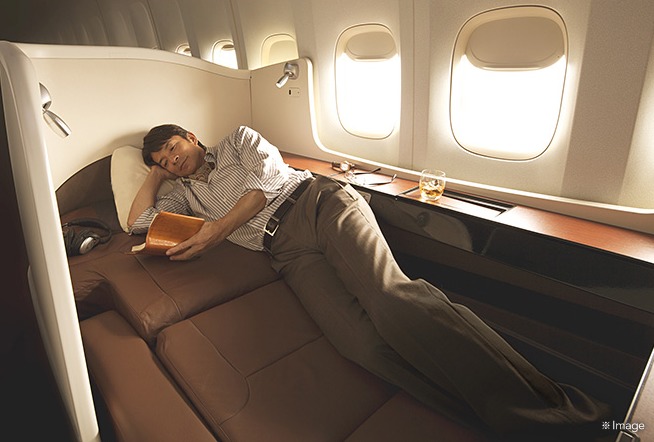 a man sleeping on a plane