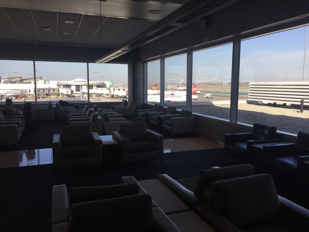 a room with many chairs and a large window