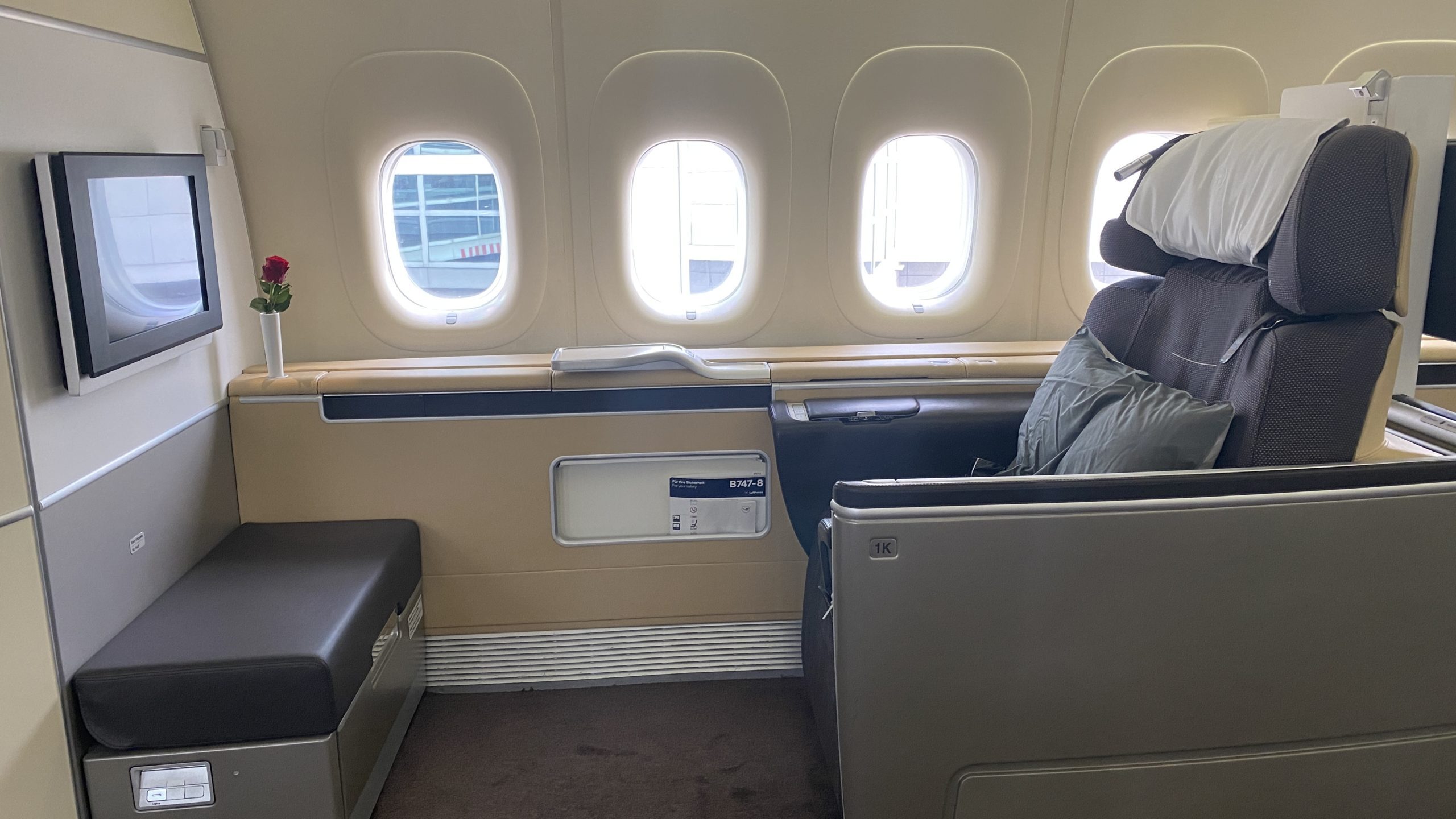 a person sitting in a seat on an airplane