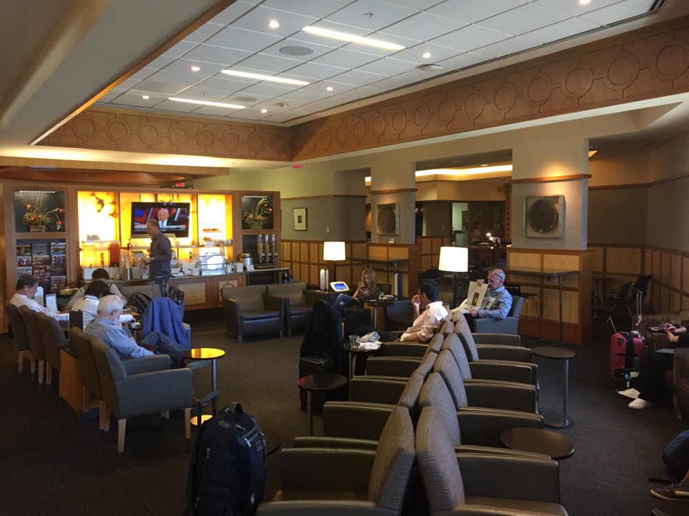 a group of people sitting in a lounge area