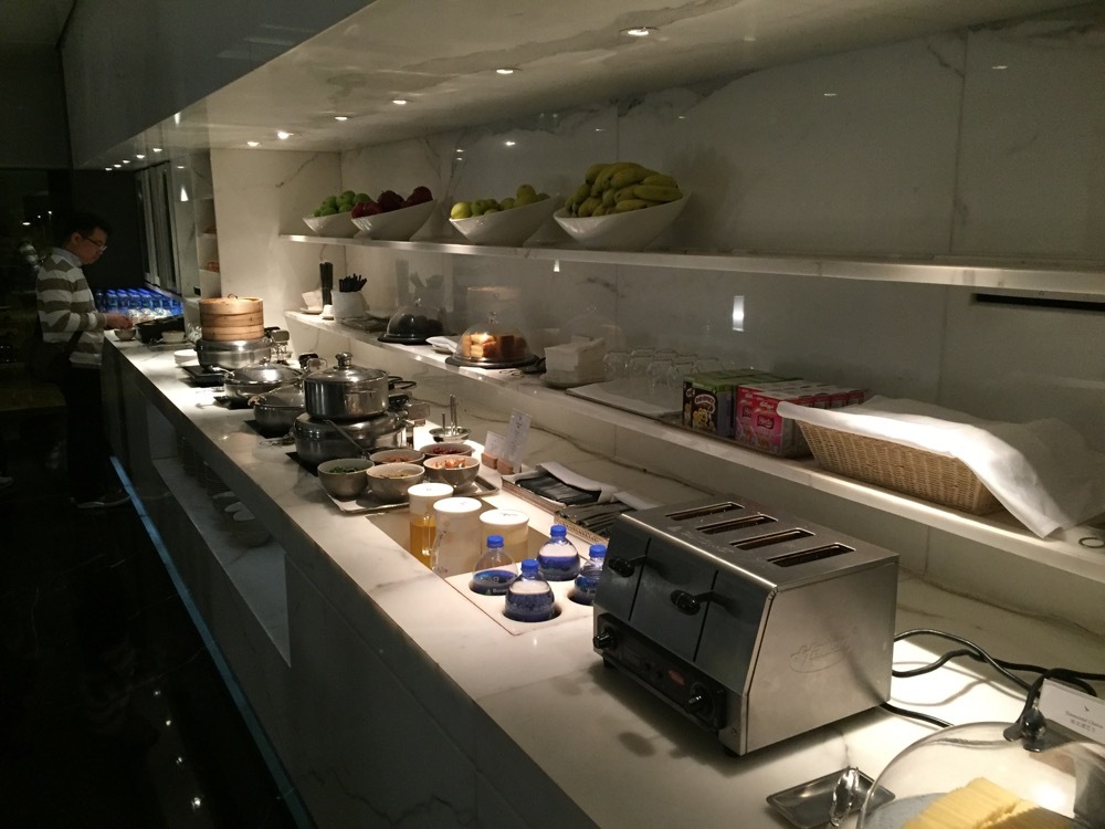 a kitchen with a variety of dishes on the counter