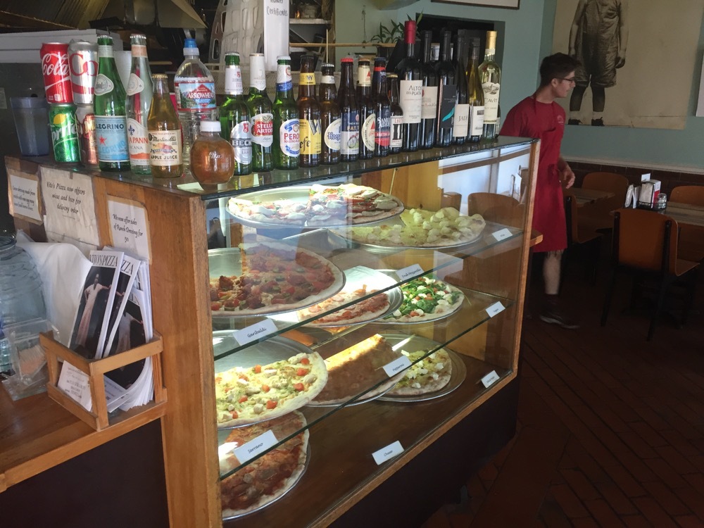 a display case with food and drinks on it