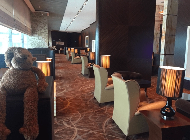 a room with chairs and a teddy bear