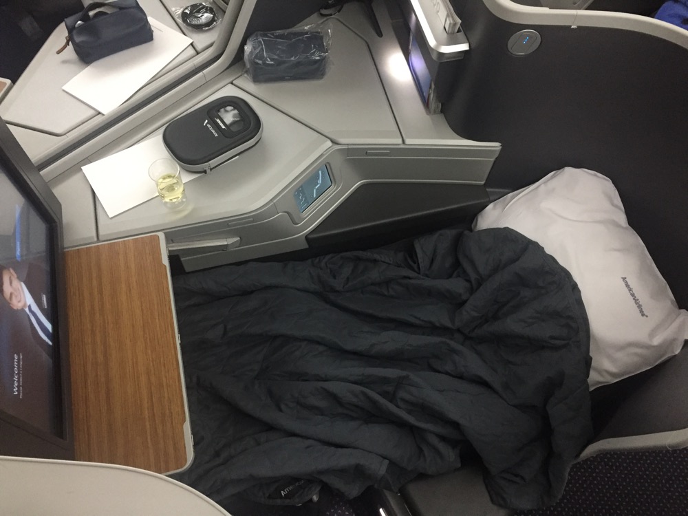 a black blanket on a bed