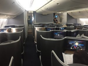 a group of people sitting in an airplane