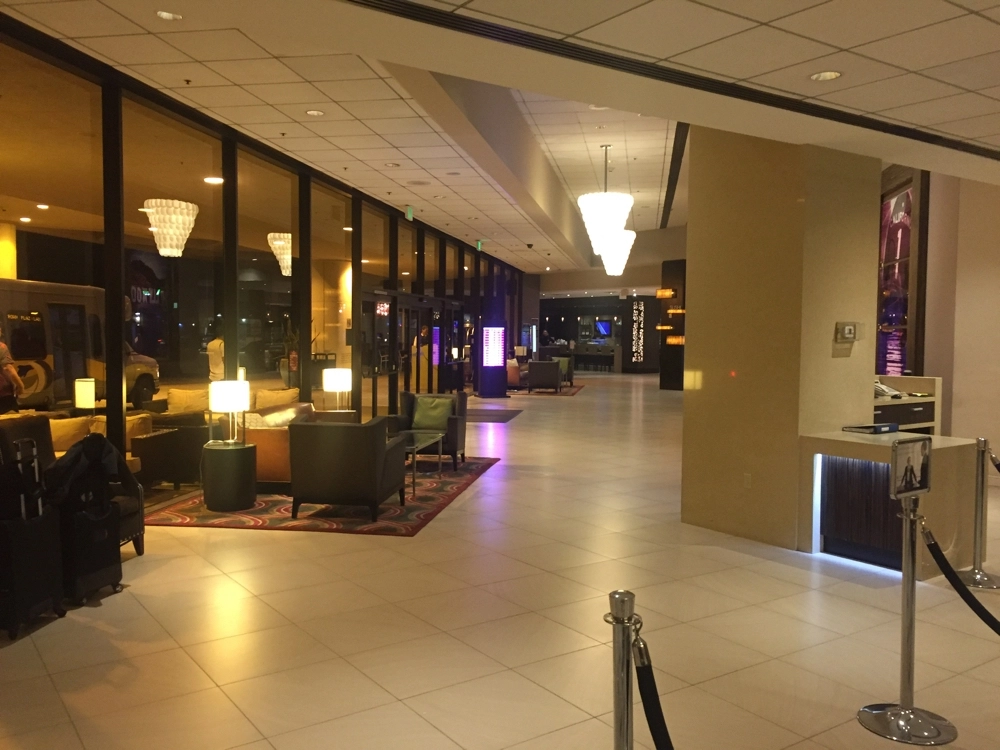 a lobby with a large glass door and a large window