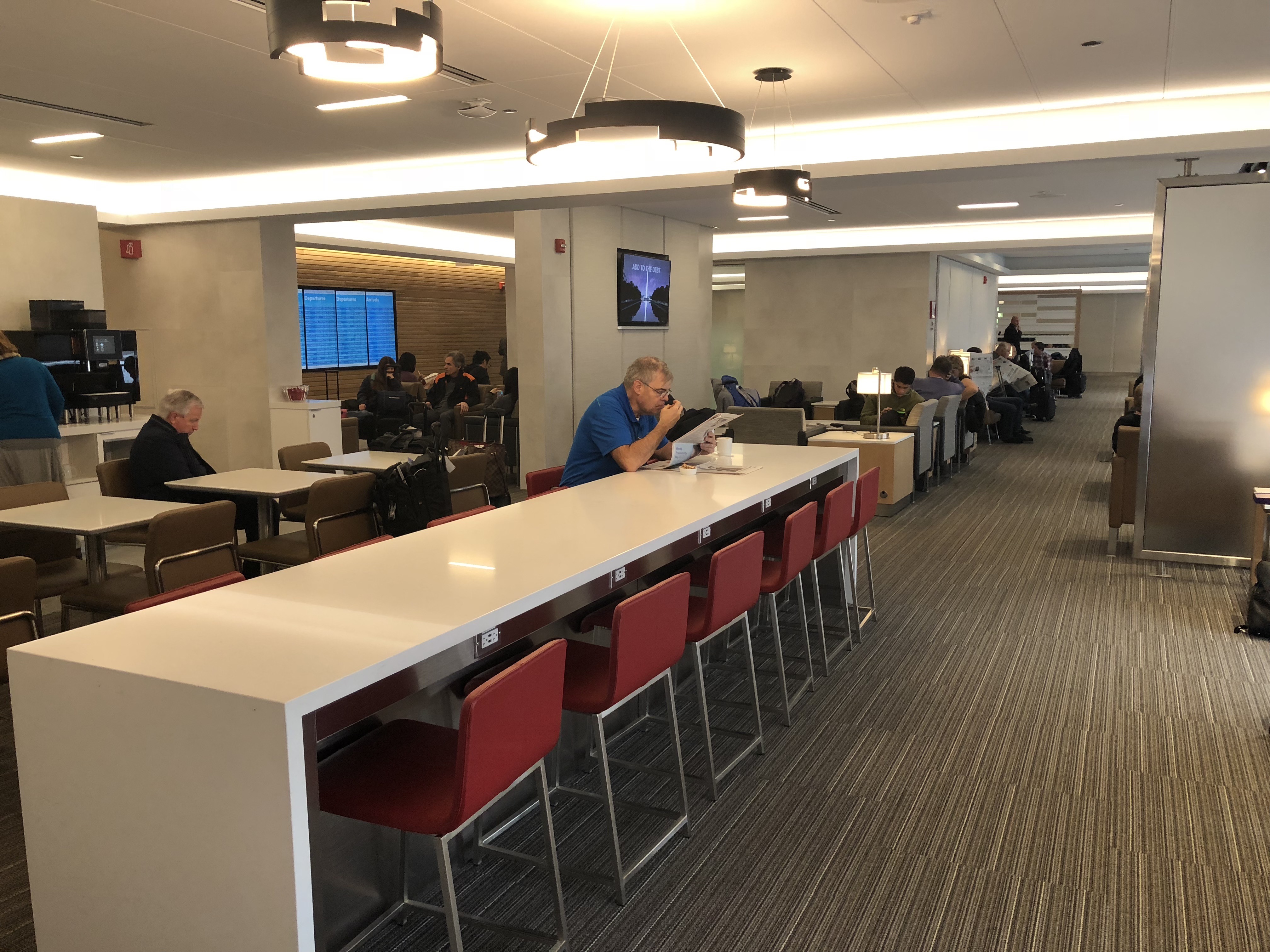 a group of people sitting at tables in a room