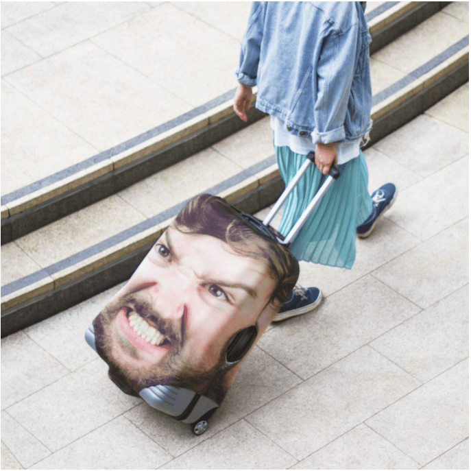 a person with a suitcase on their wheels