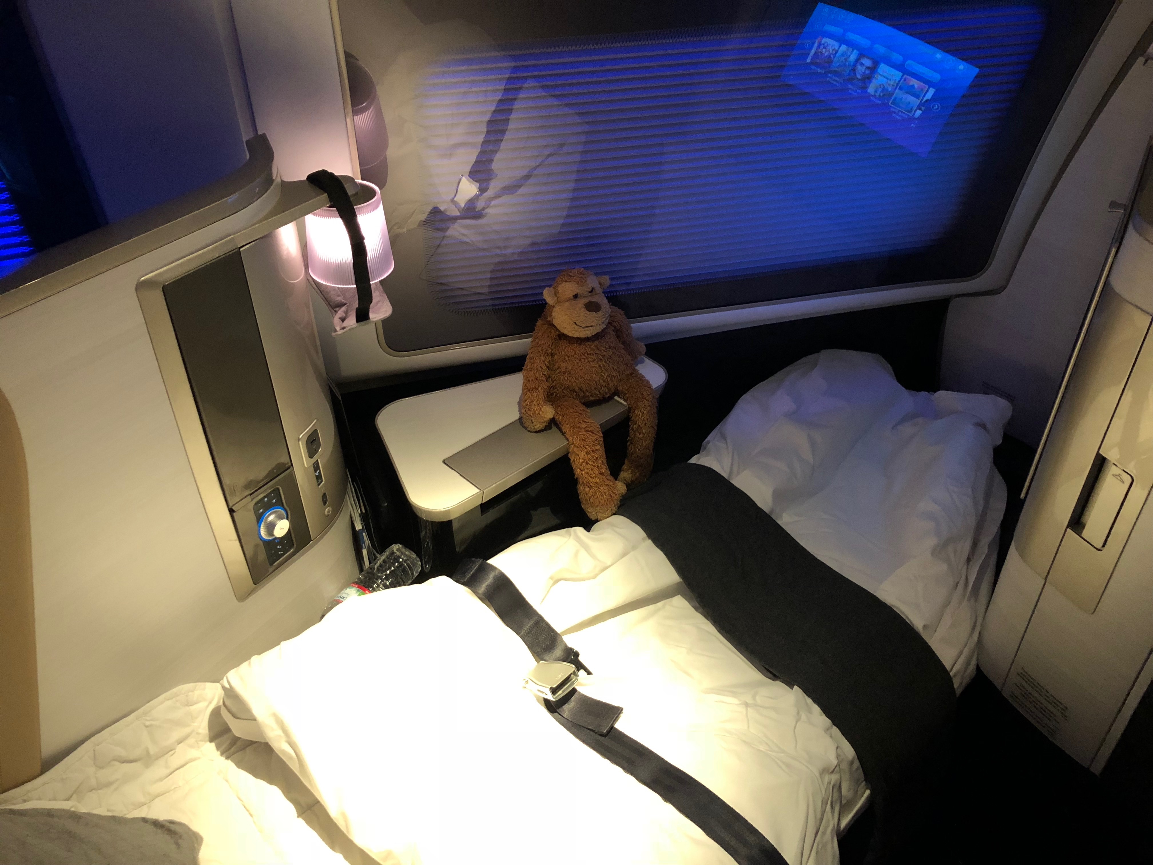 a teddy bear on a bed