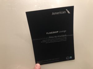 a hand holding a black card