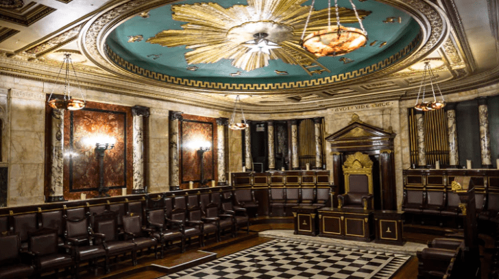 a room with chairs and a checkered floor