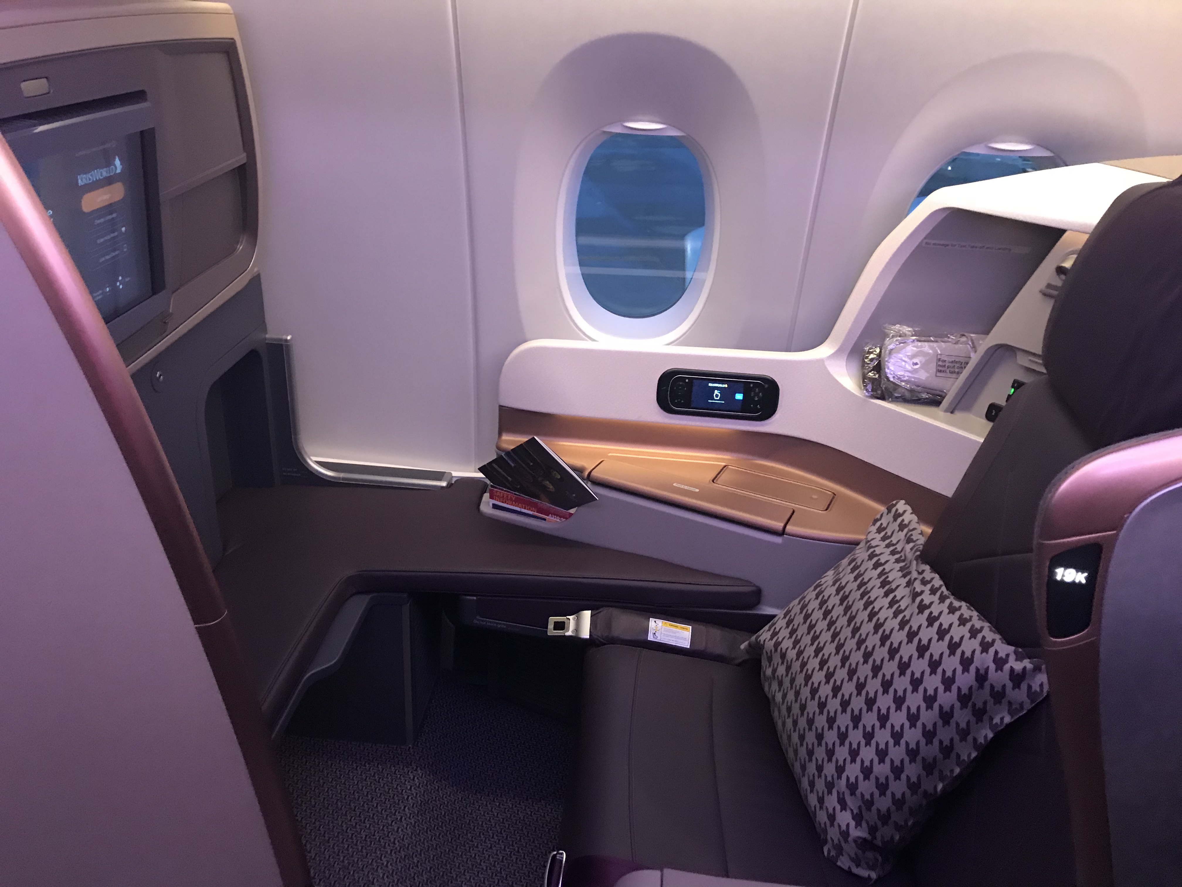 a seat and a table in a plane
