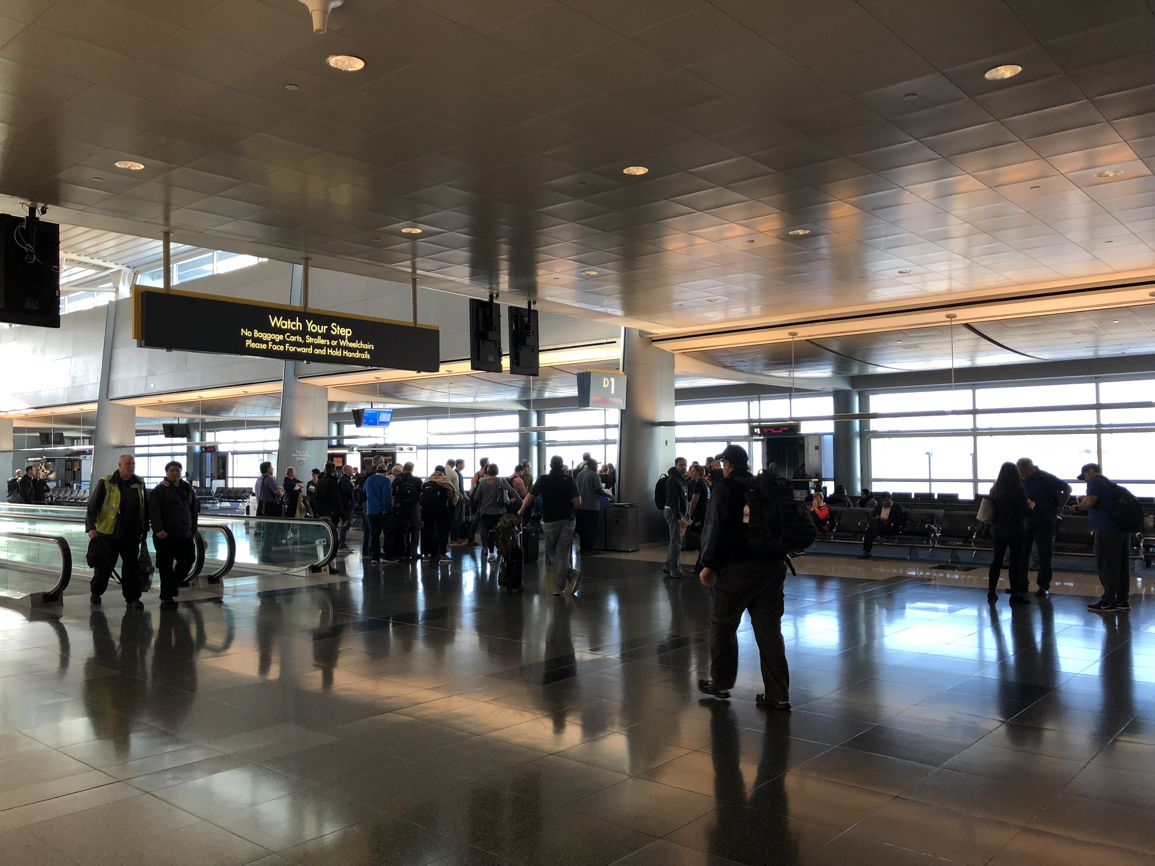 people walking in a large airport