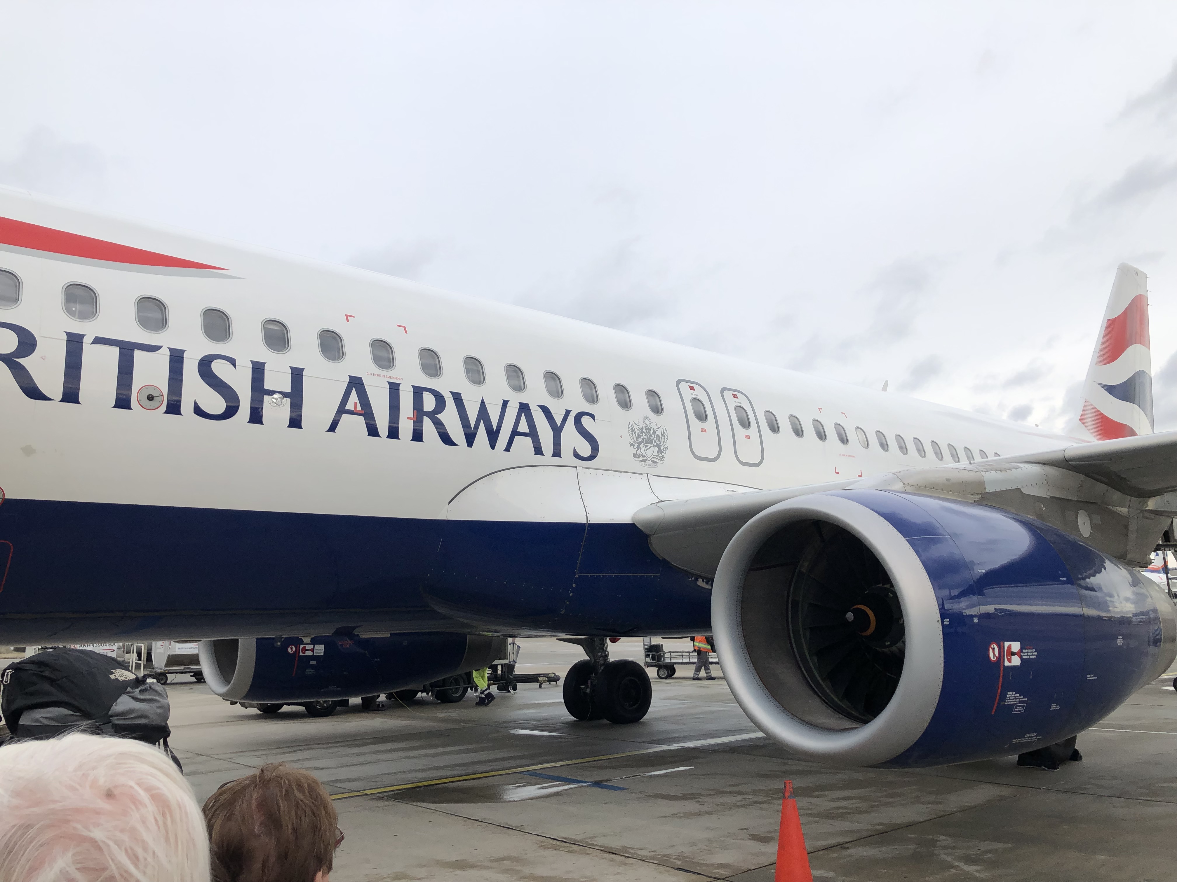 a large airplane with blue and white text