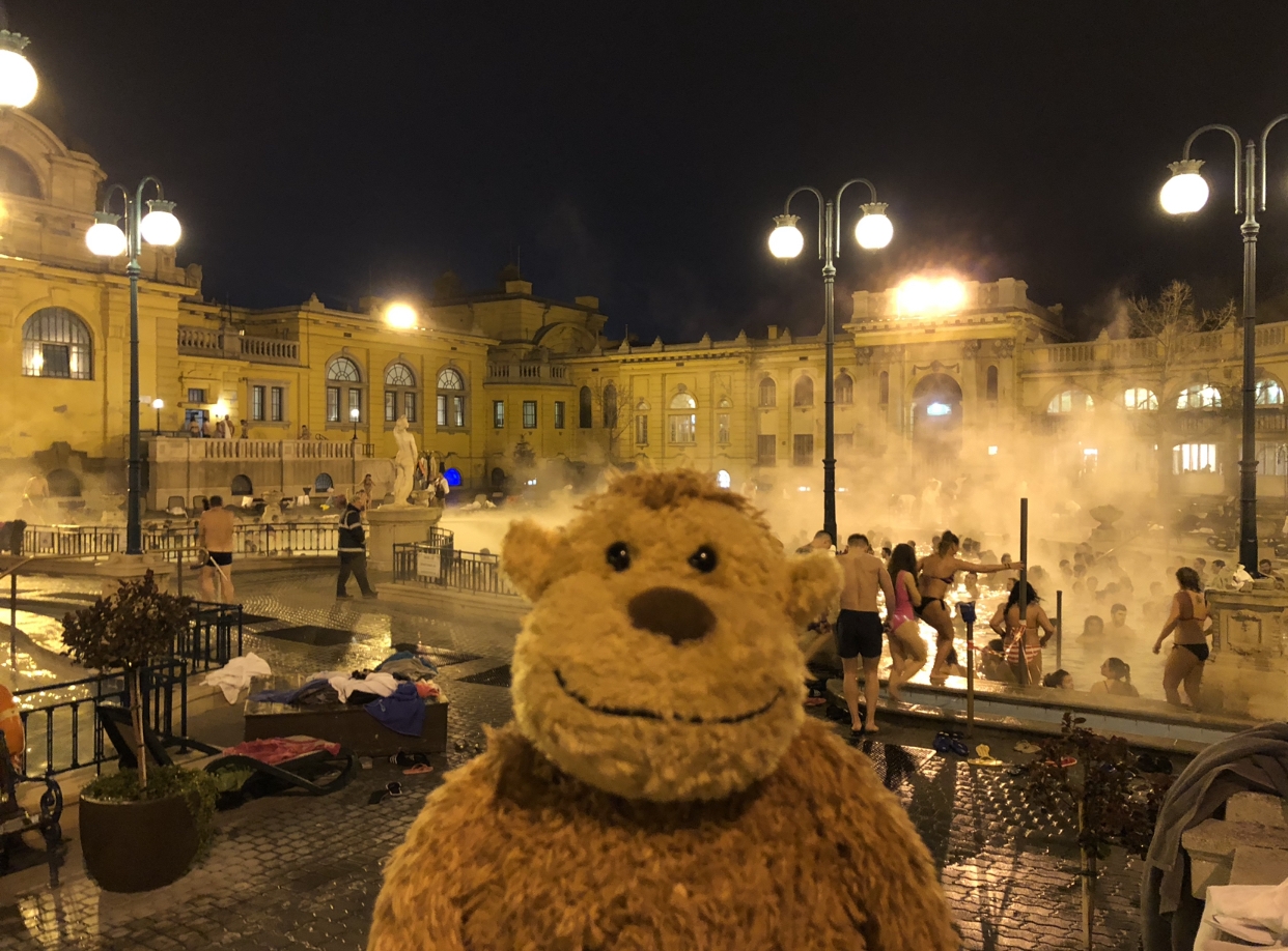 a person in a garment in front of a building