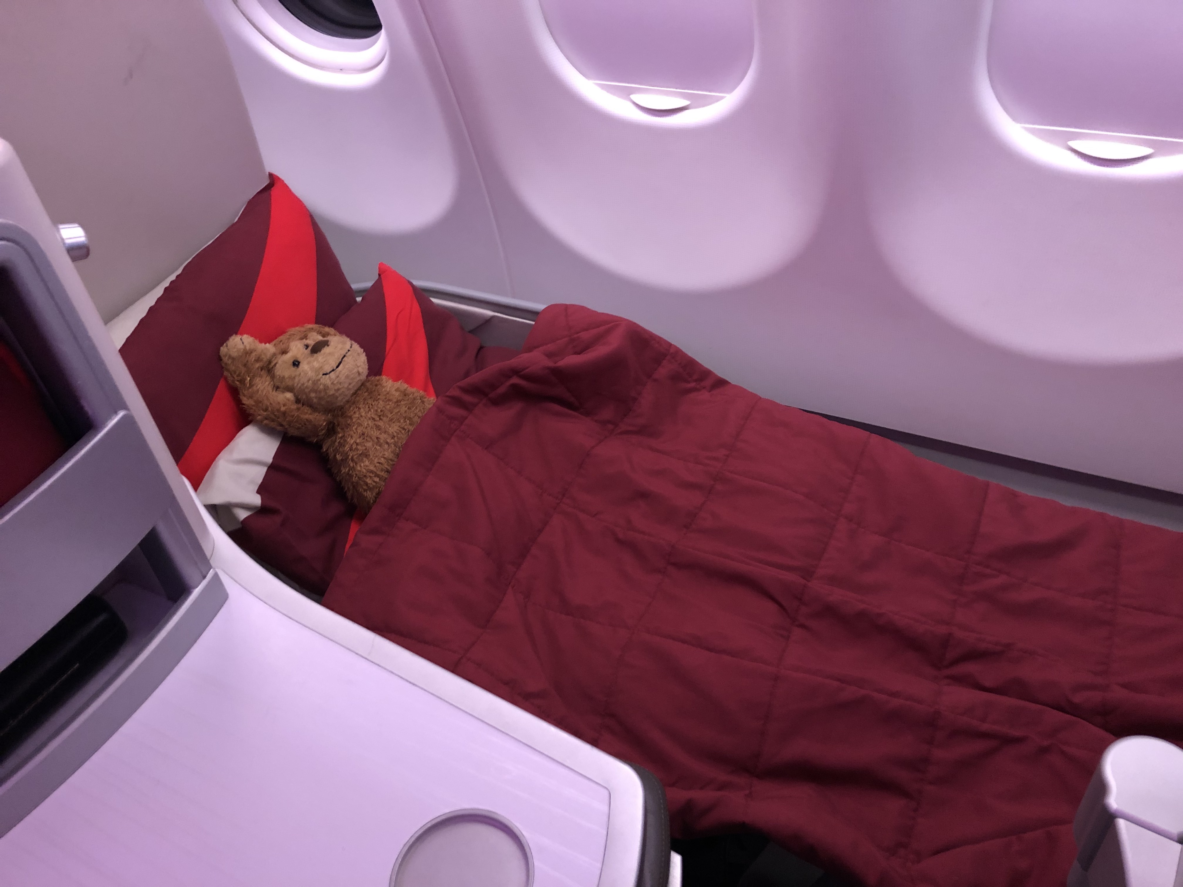 a stuffed animal in a bed