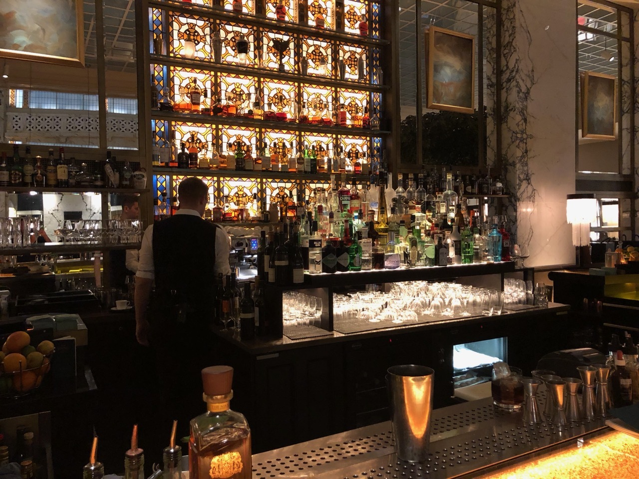 a bar with many bottles of alcohol