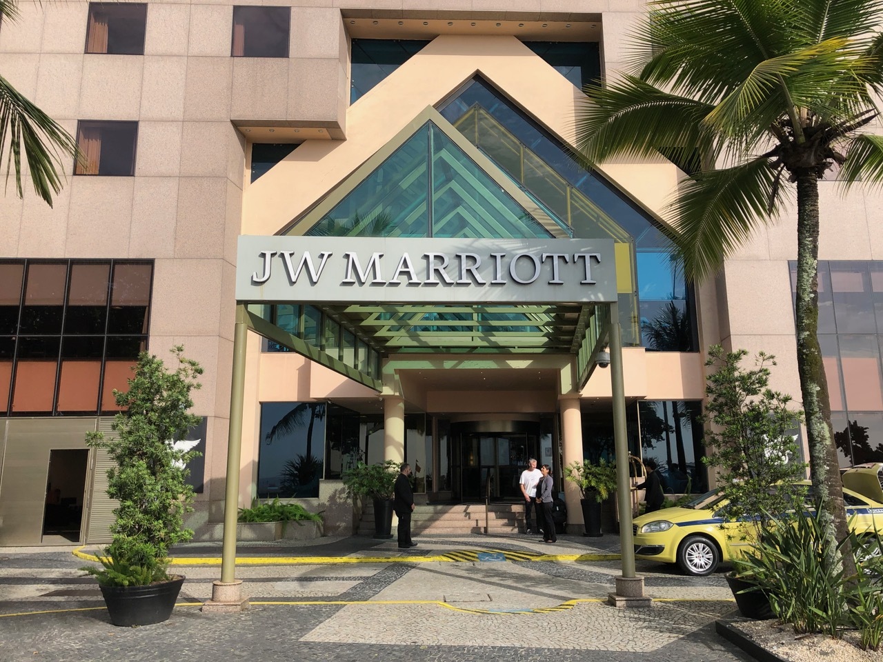 a building with a glass roof and a sign