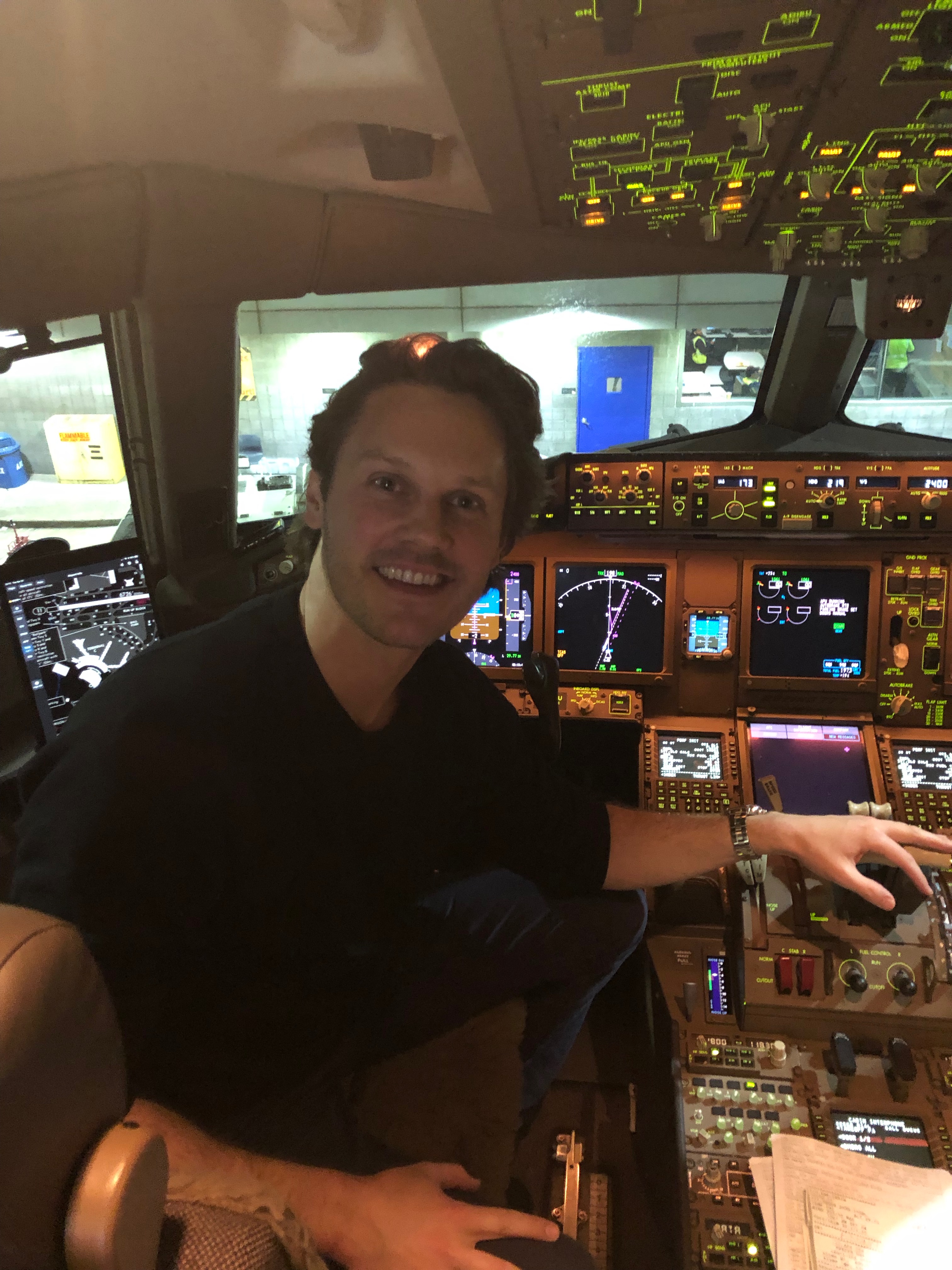 a man sitting in a cockpit