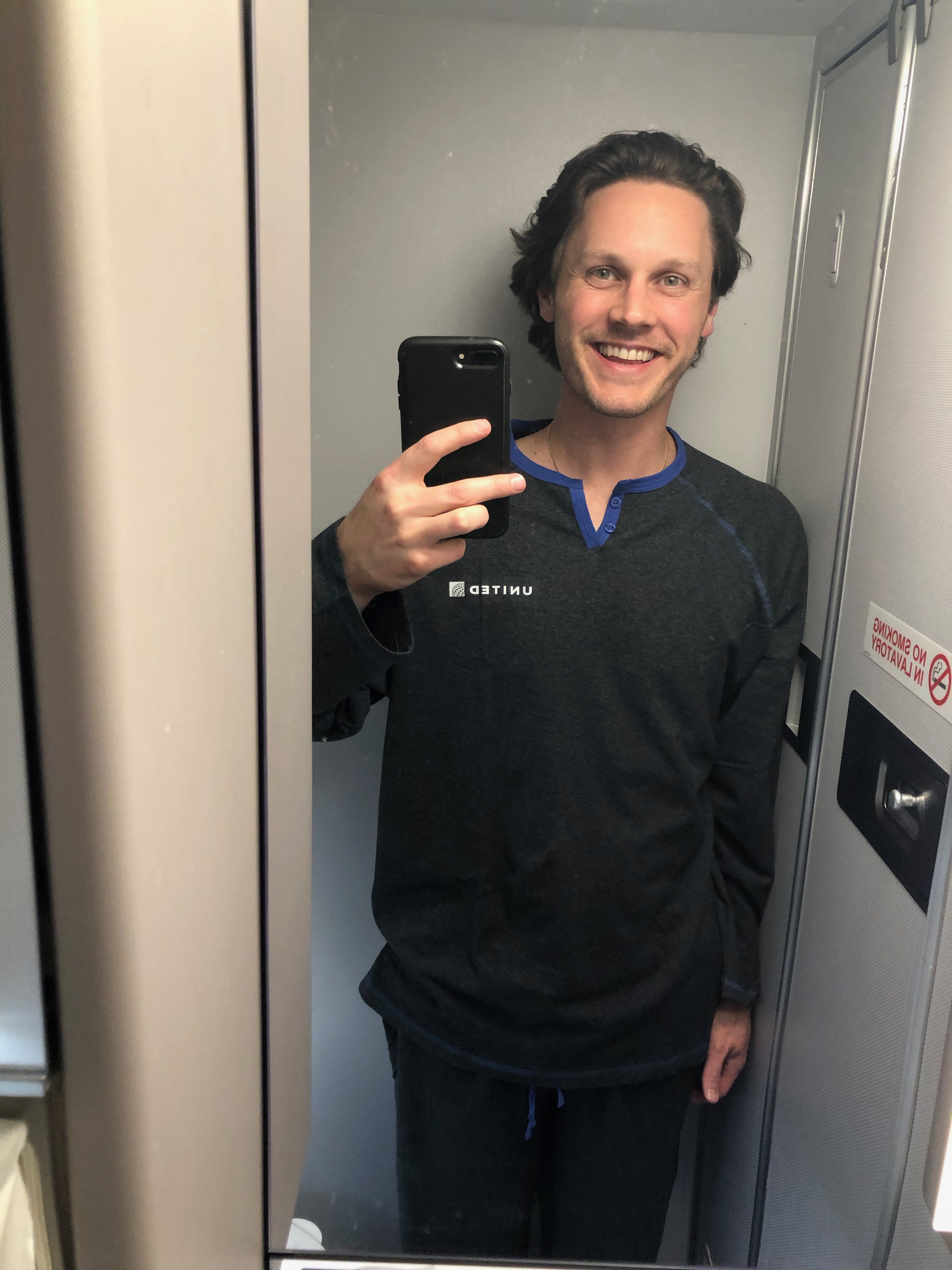 a man taking a selfie in a mirror