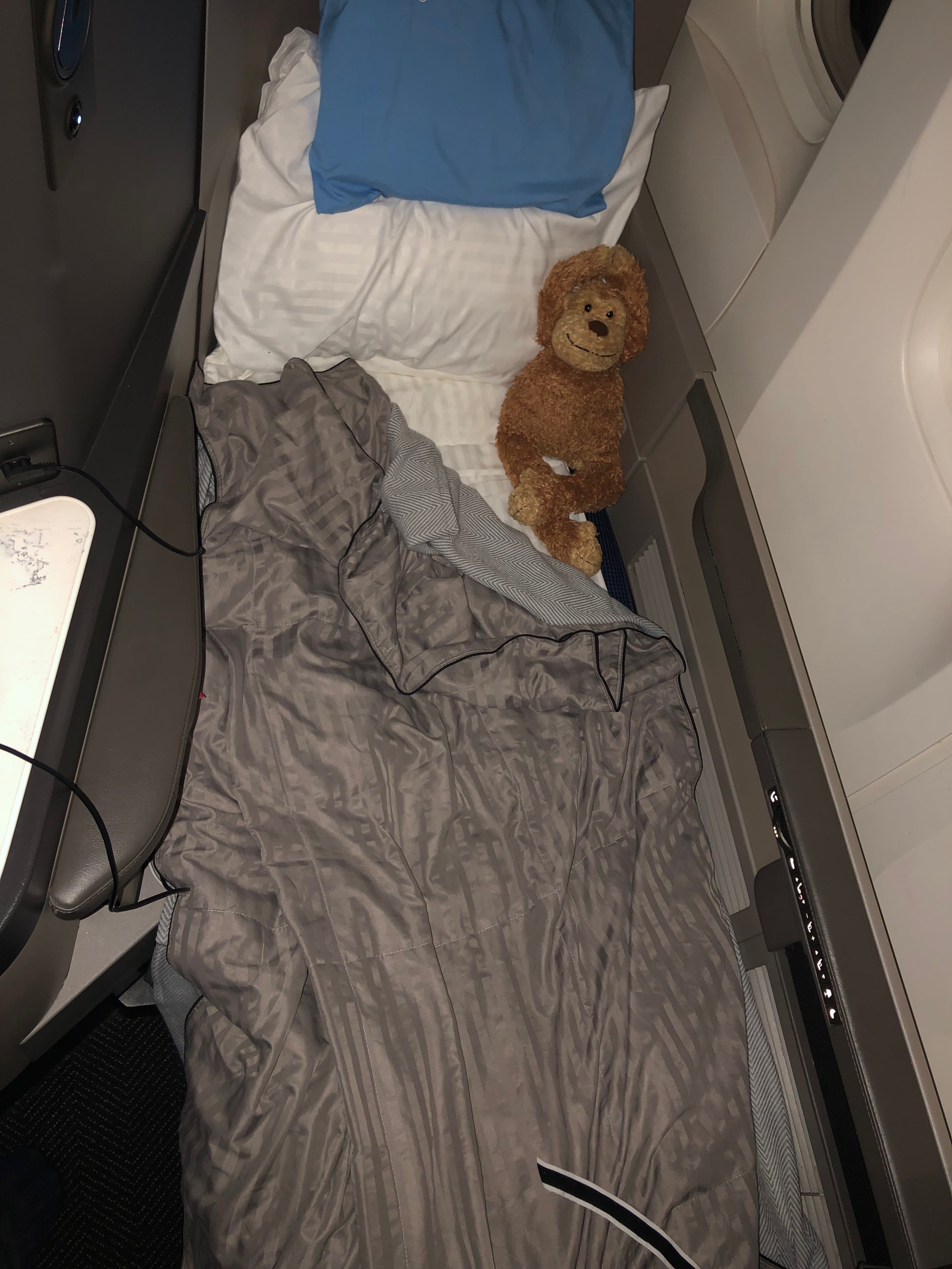 a stuffed animal on a bed