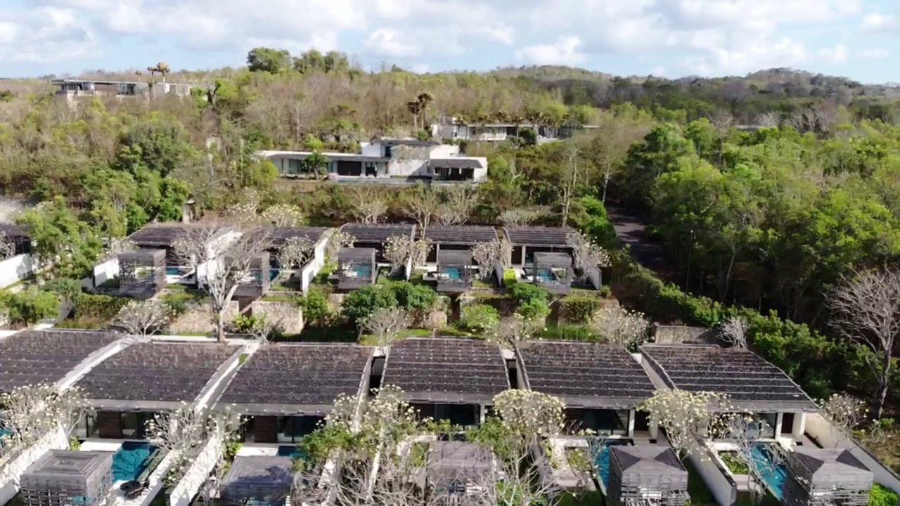 a group of houses in a forest