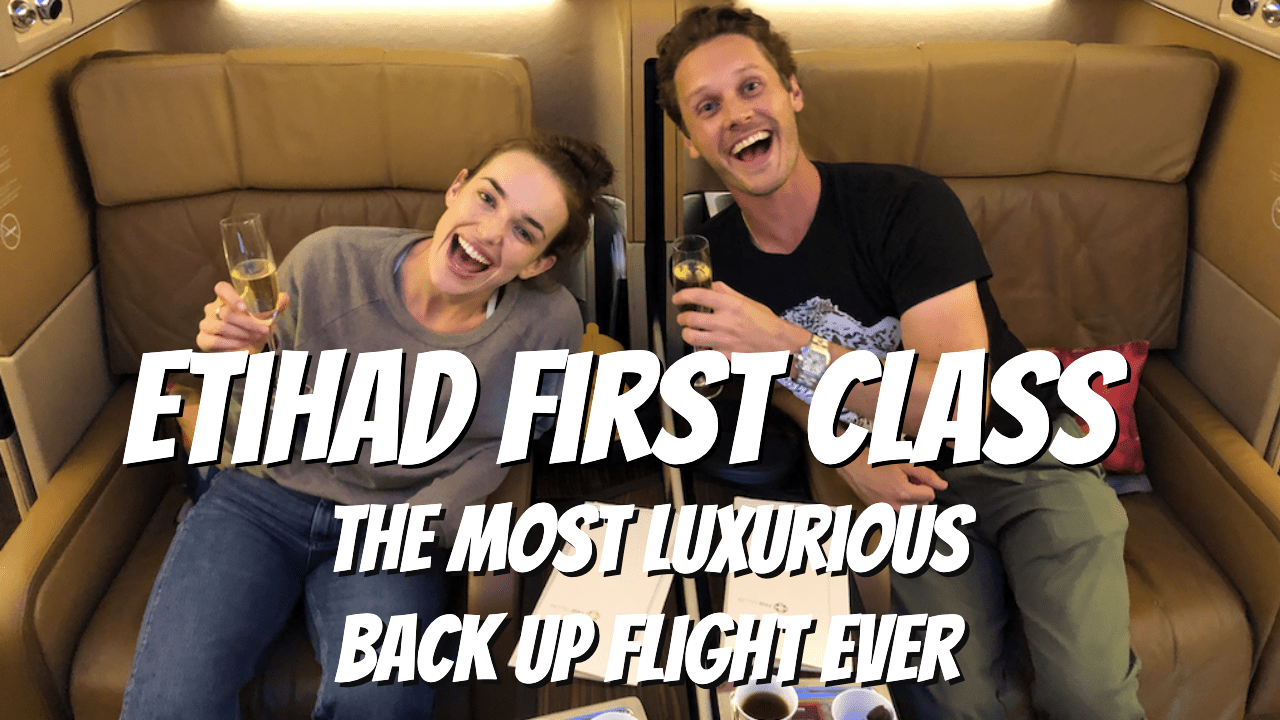 a man and woman sitting in an airplane