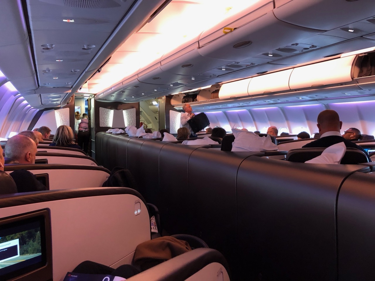 a group of people sitting in an airplane