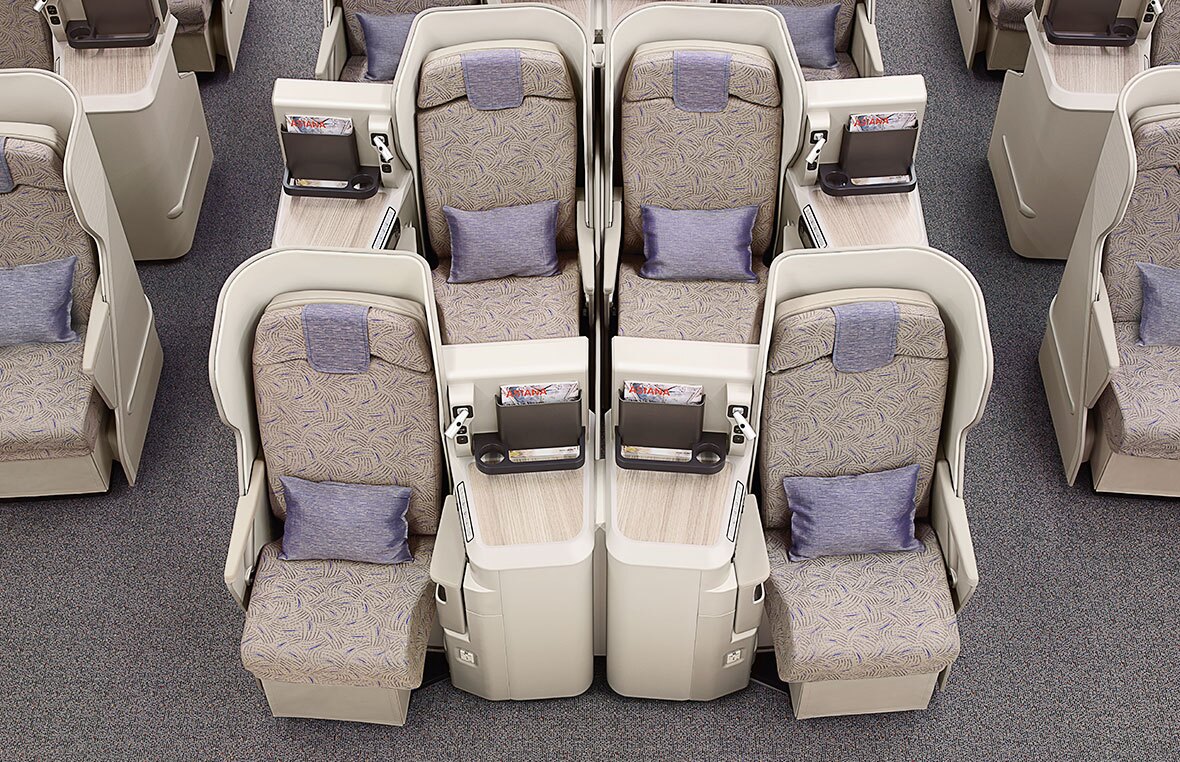 a group of seats with a laptop on the side