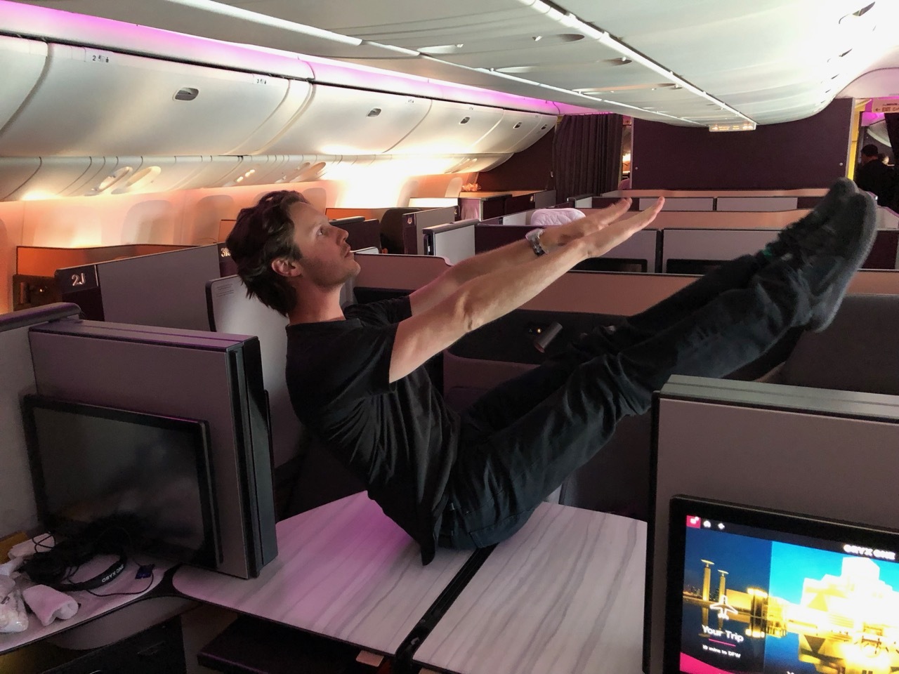a man sitting on a desk with his legs up
