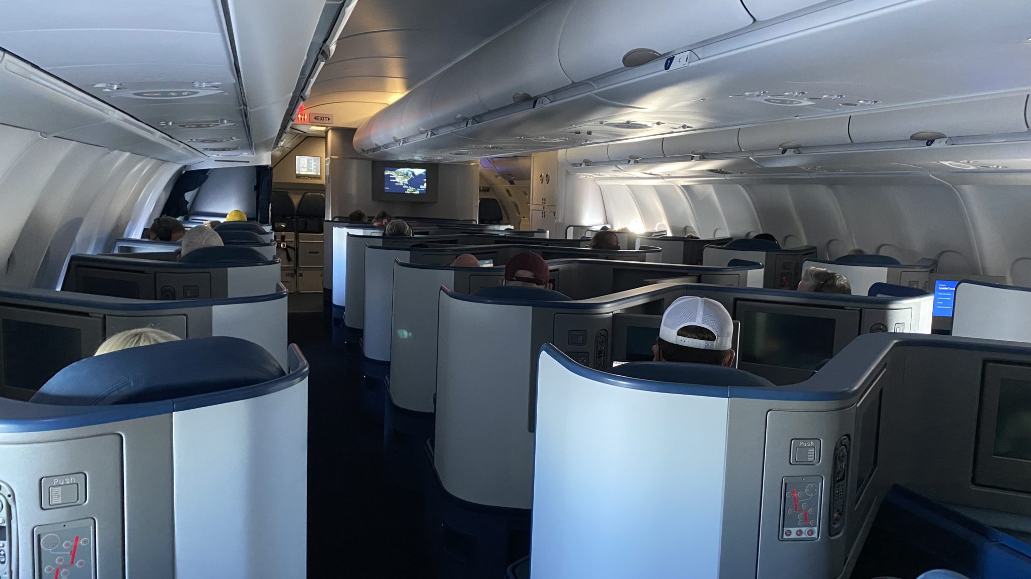 a group of people sitting in an airplane