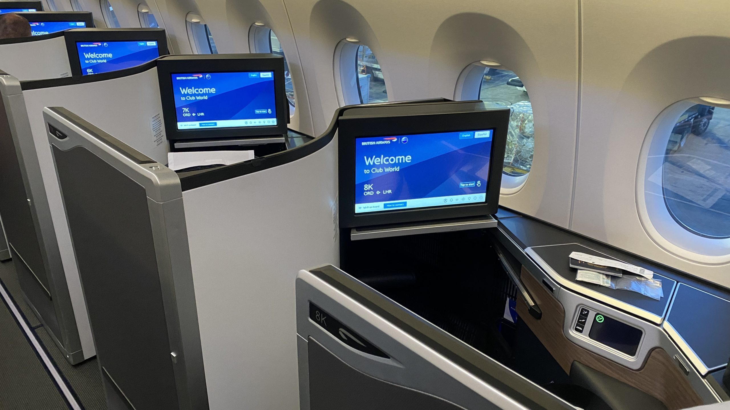 a row of monitors on an airplane