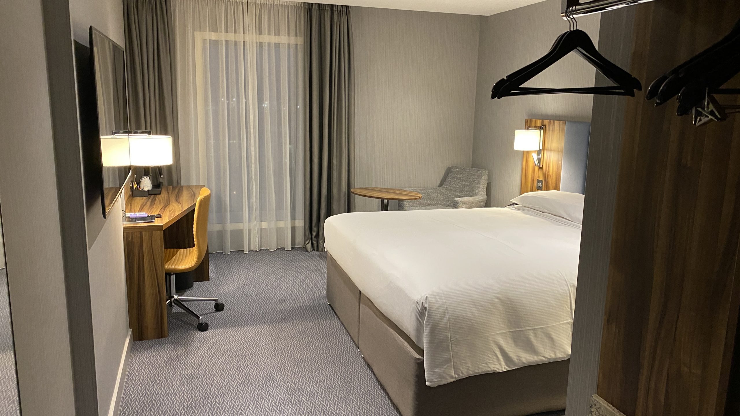 a room with a bed and a desk