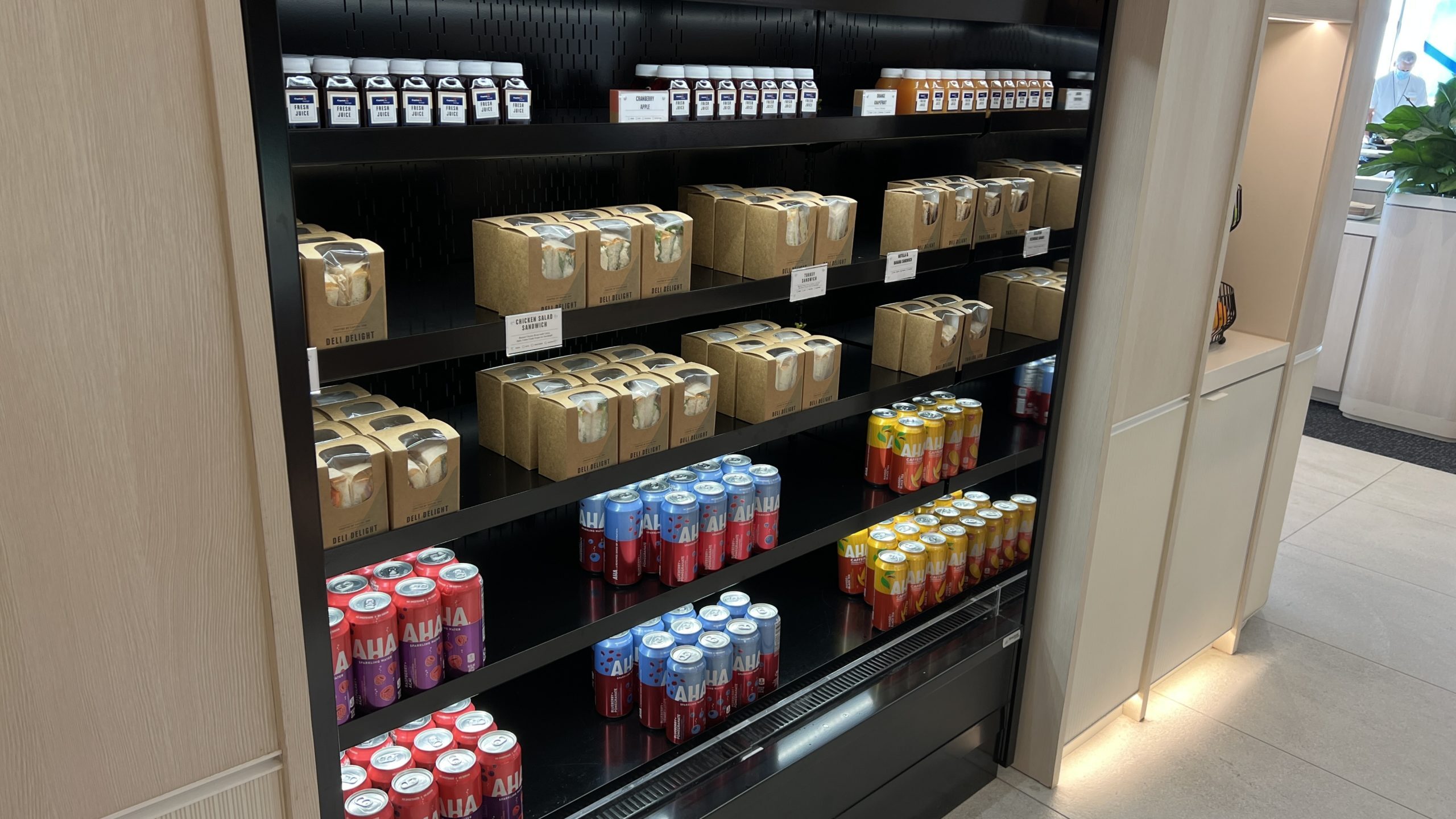 a shelf with cans and drinks on it