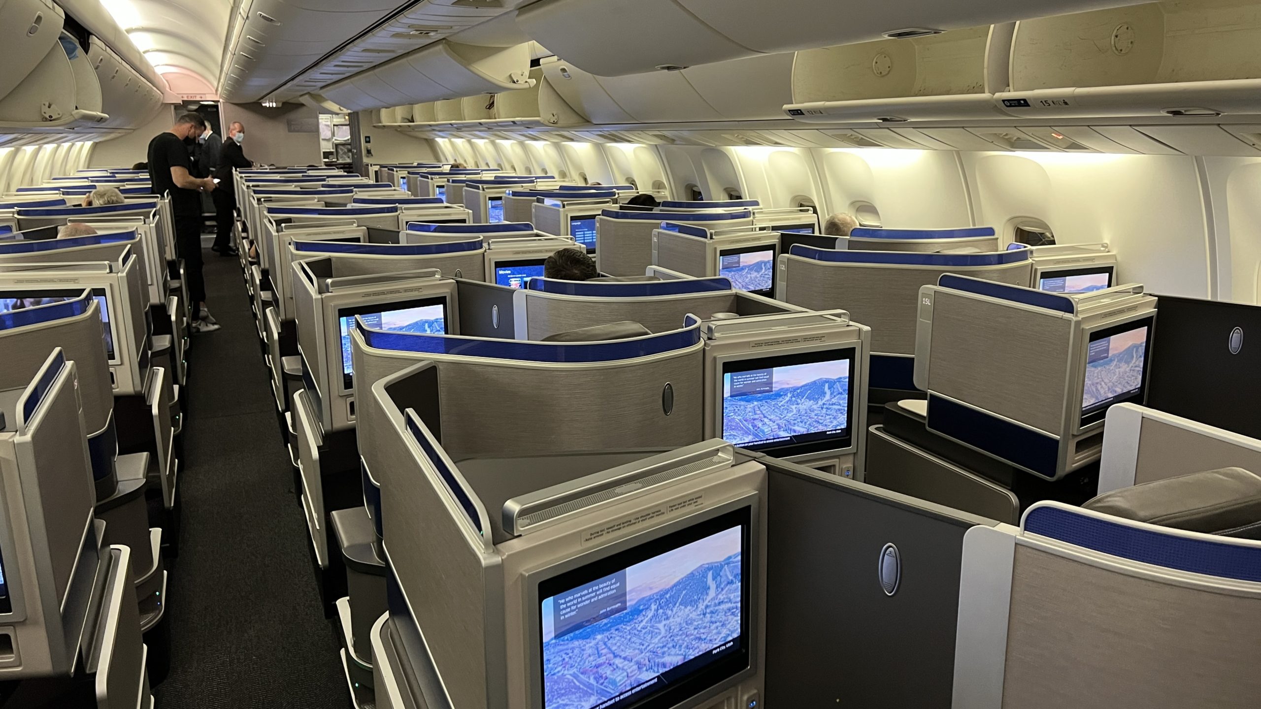 a row of monitors on an airplane