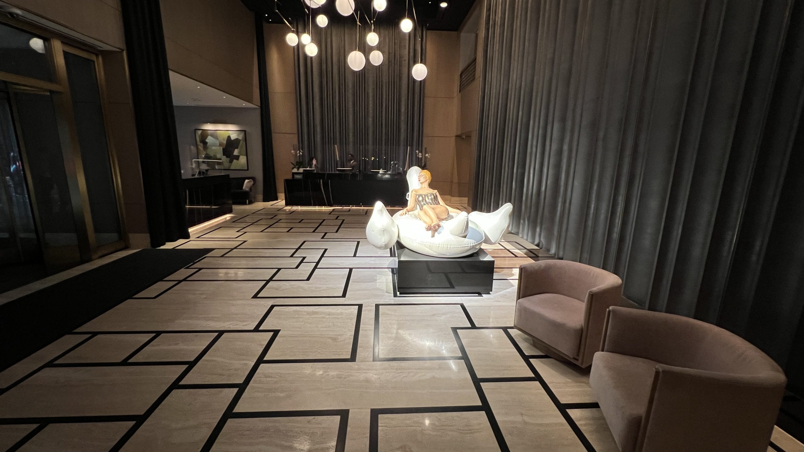 a room with a mannequin in a chair