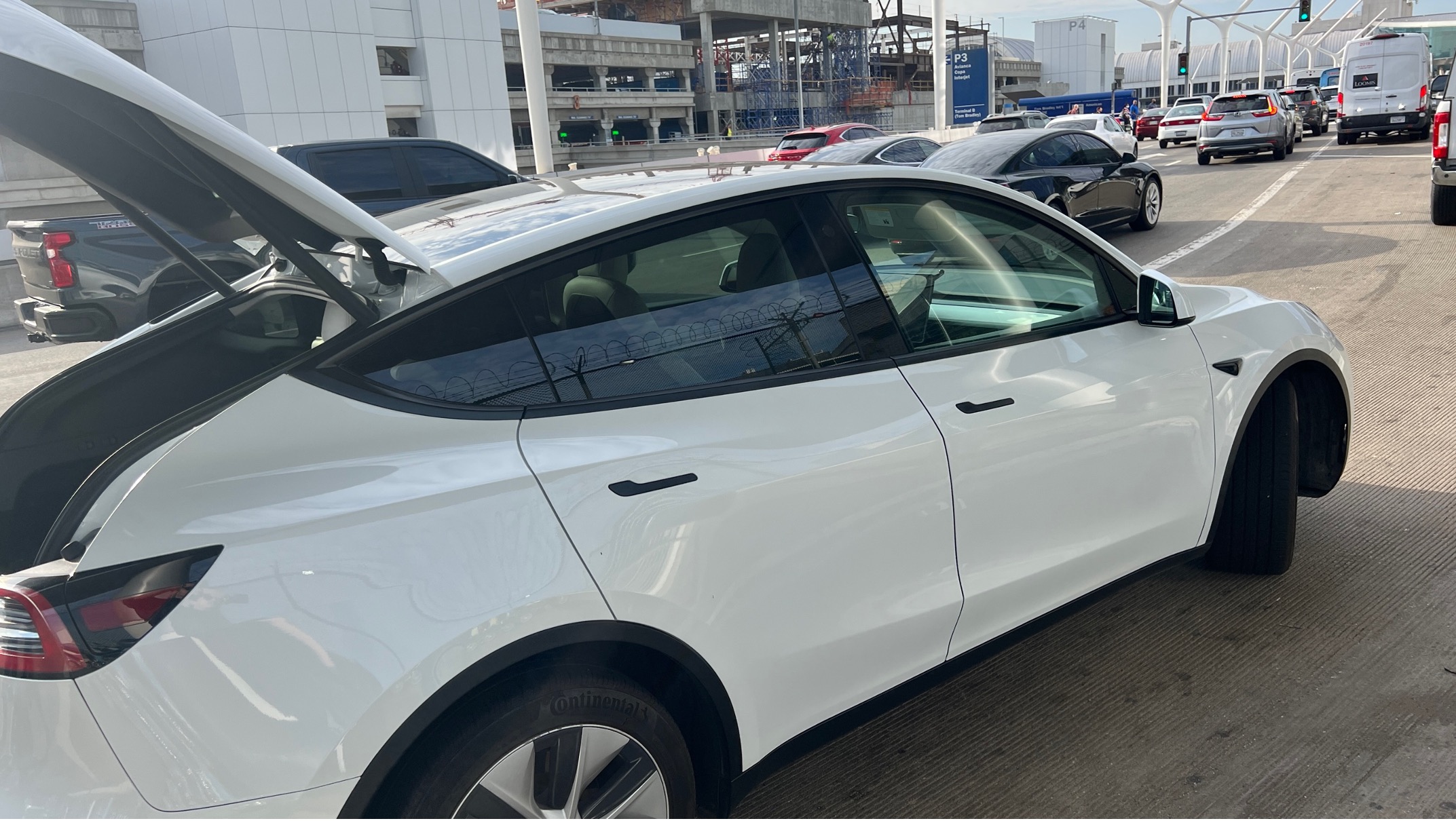 a white car with its trunk open