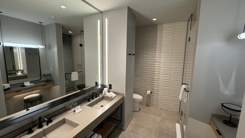 a bathroom with a large mirror and sink