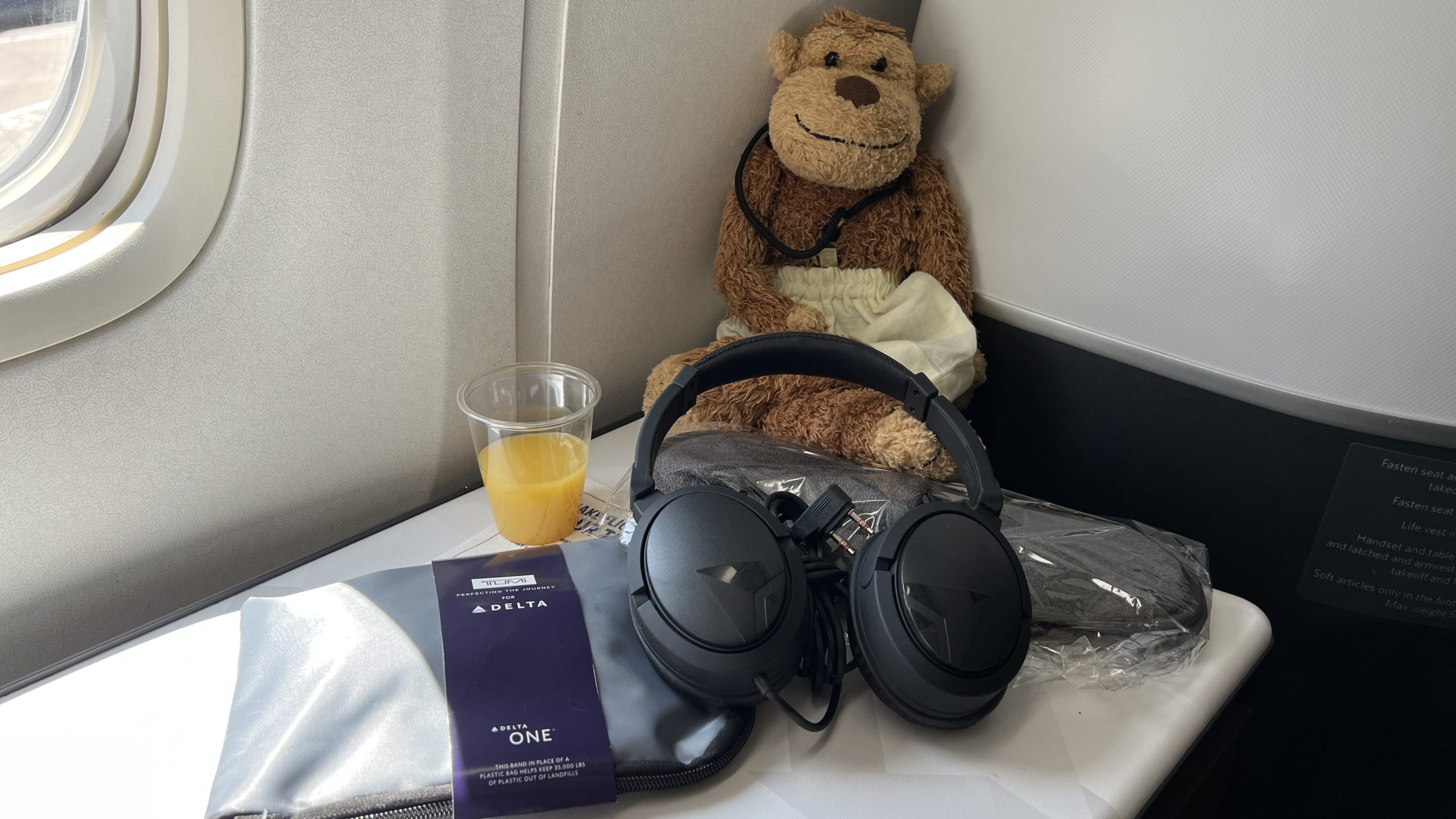 a stuffed animal next to a pair of headphones