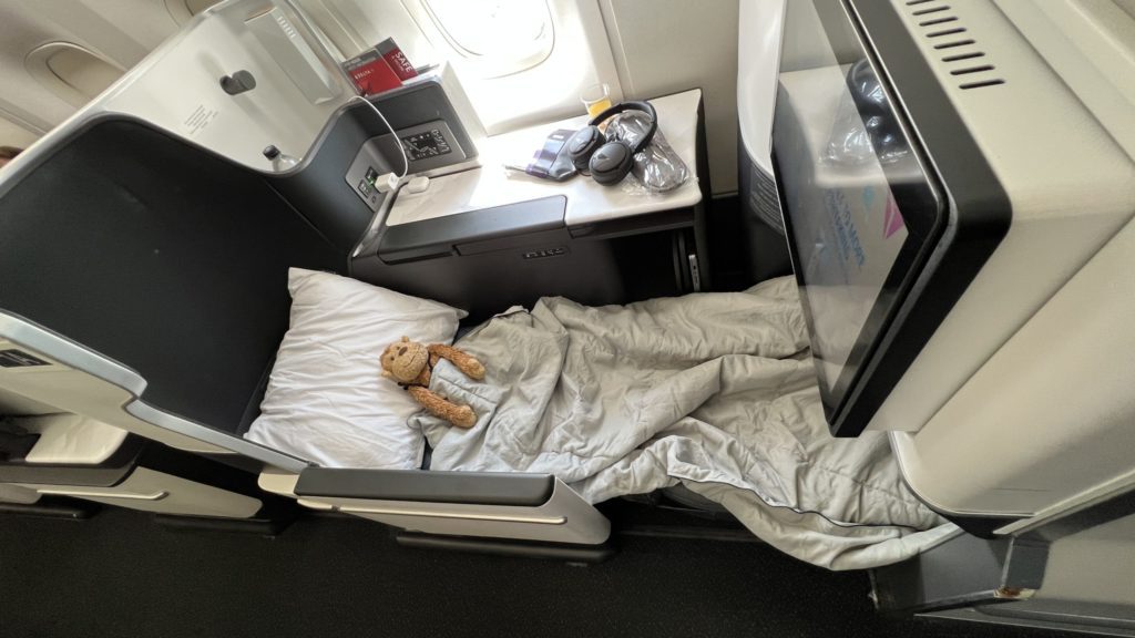 a teddy bear on a bed