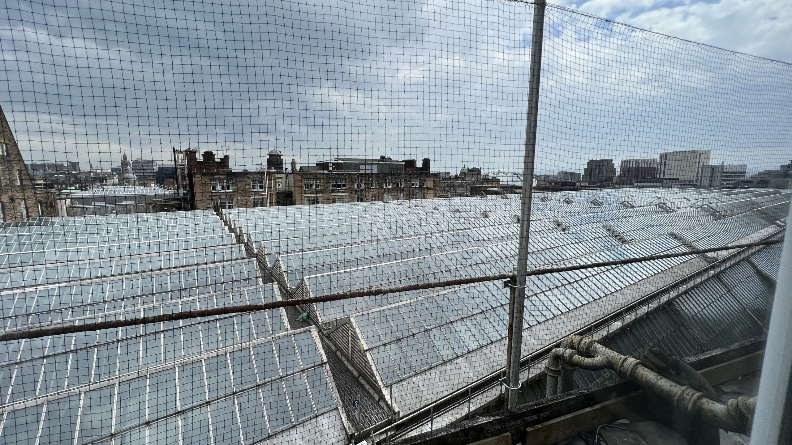 a rooftop of a building with a net