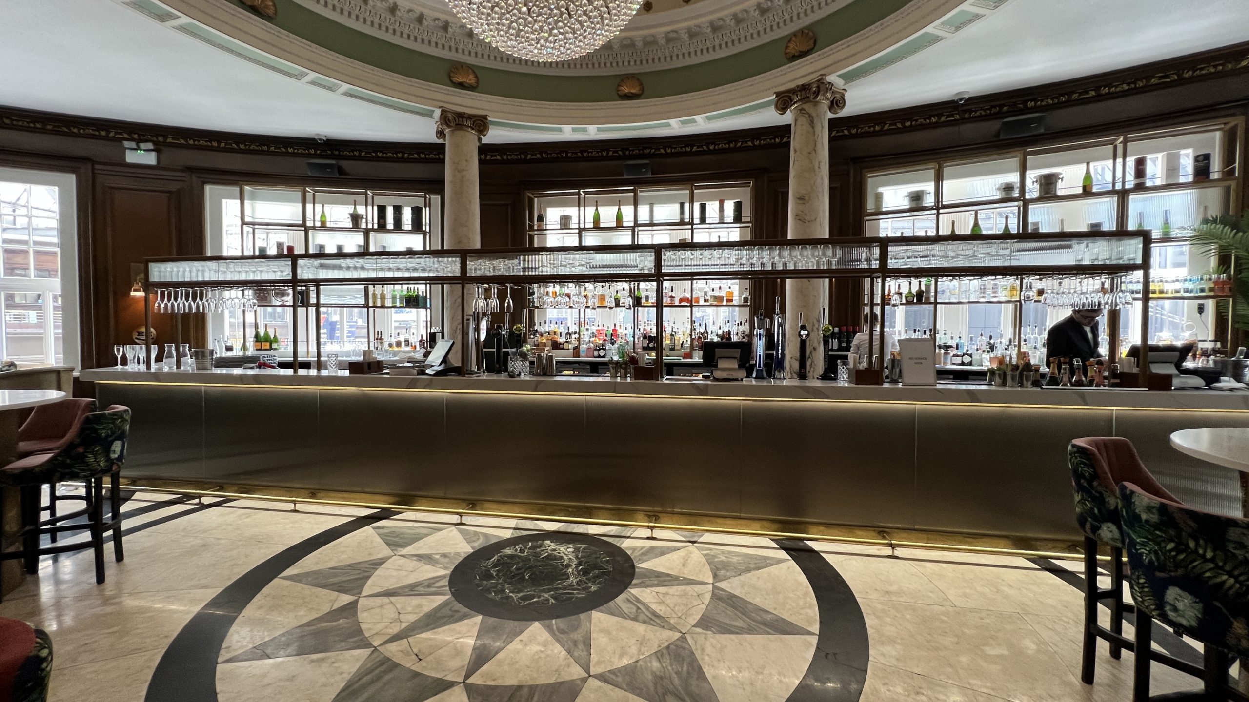 a bar with bottles on the counter