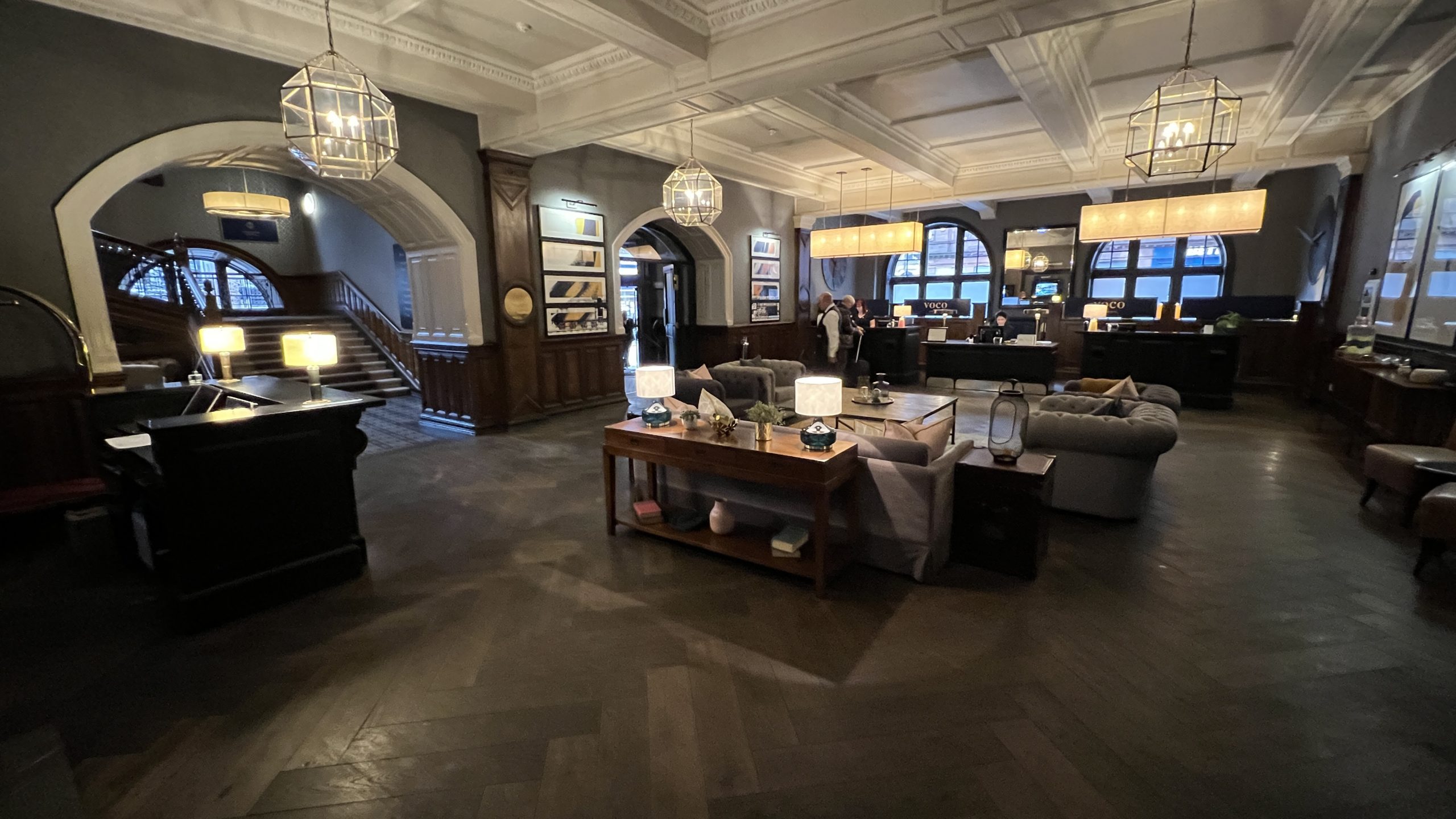 a room with a large table and chairs