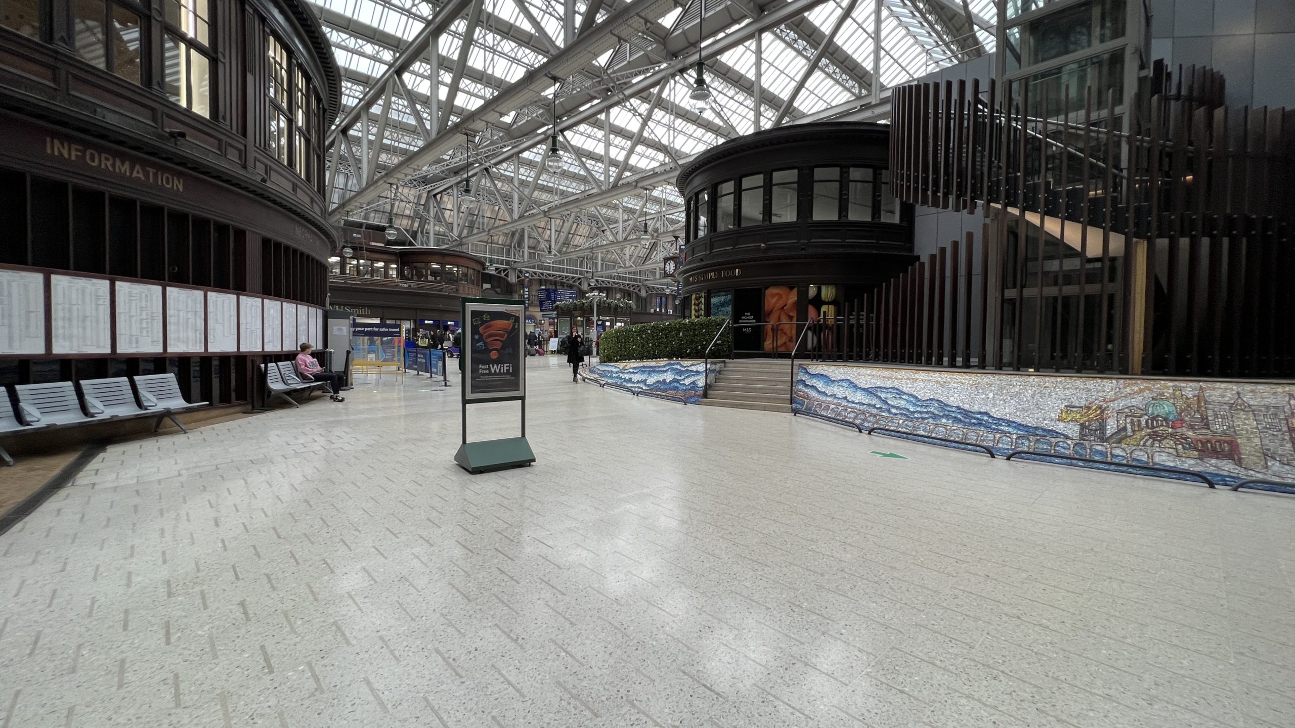 a large building with a large staircase and a sign