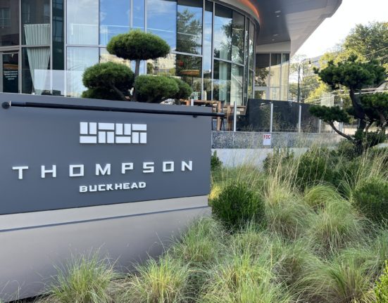 a sign in front of a building