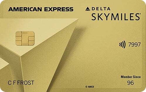 a credit card with a gold and black logo