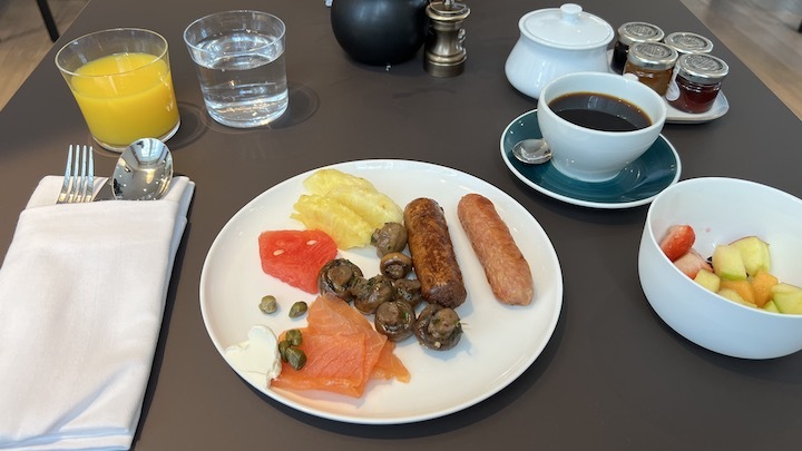 a plate of food and coffee