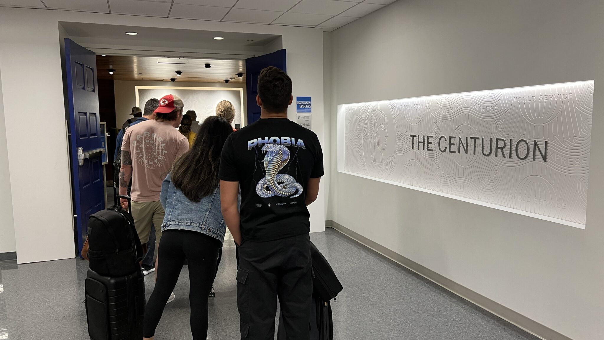 a group of people standing in a hallway