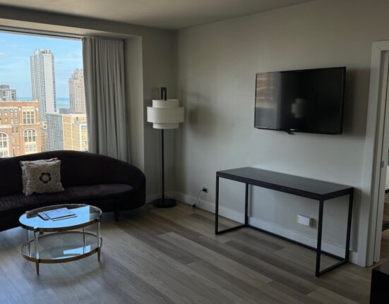 a living room with a television and a couch