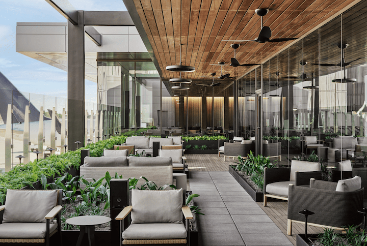 a patio with chairs and plants